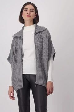 Knitted cape with honeycomb pattern